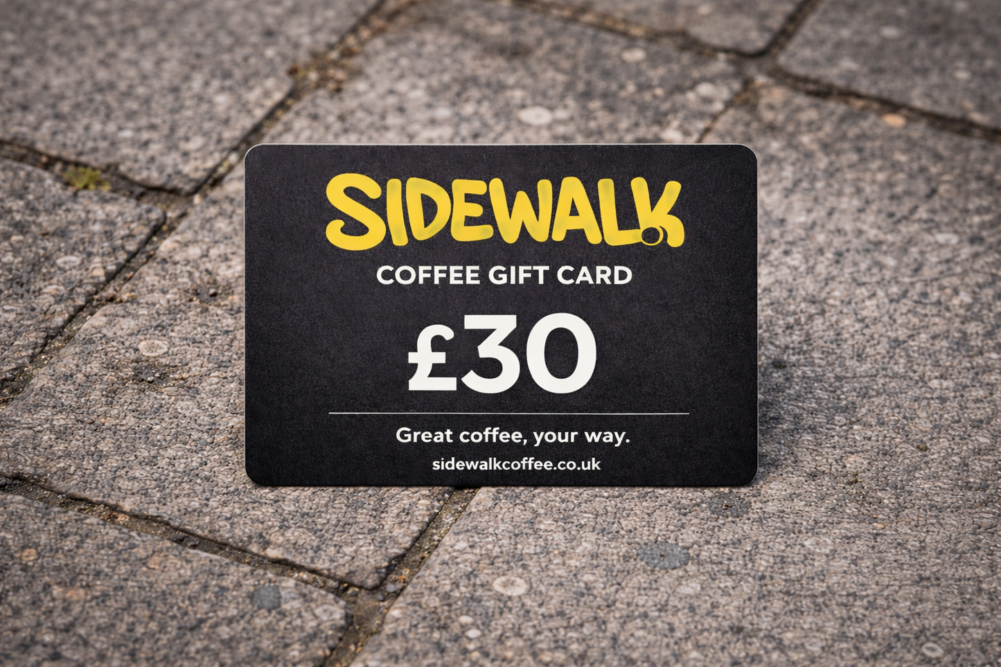 Sidewalk Coffee gift card worth £30 on a pavement