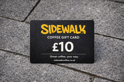 Sidewalk Coffee gift card worth £10 on a pavement background