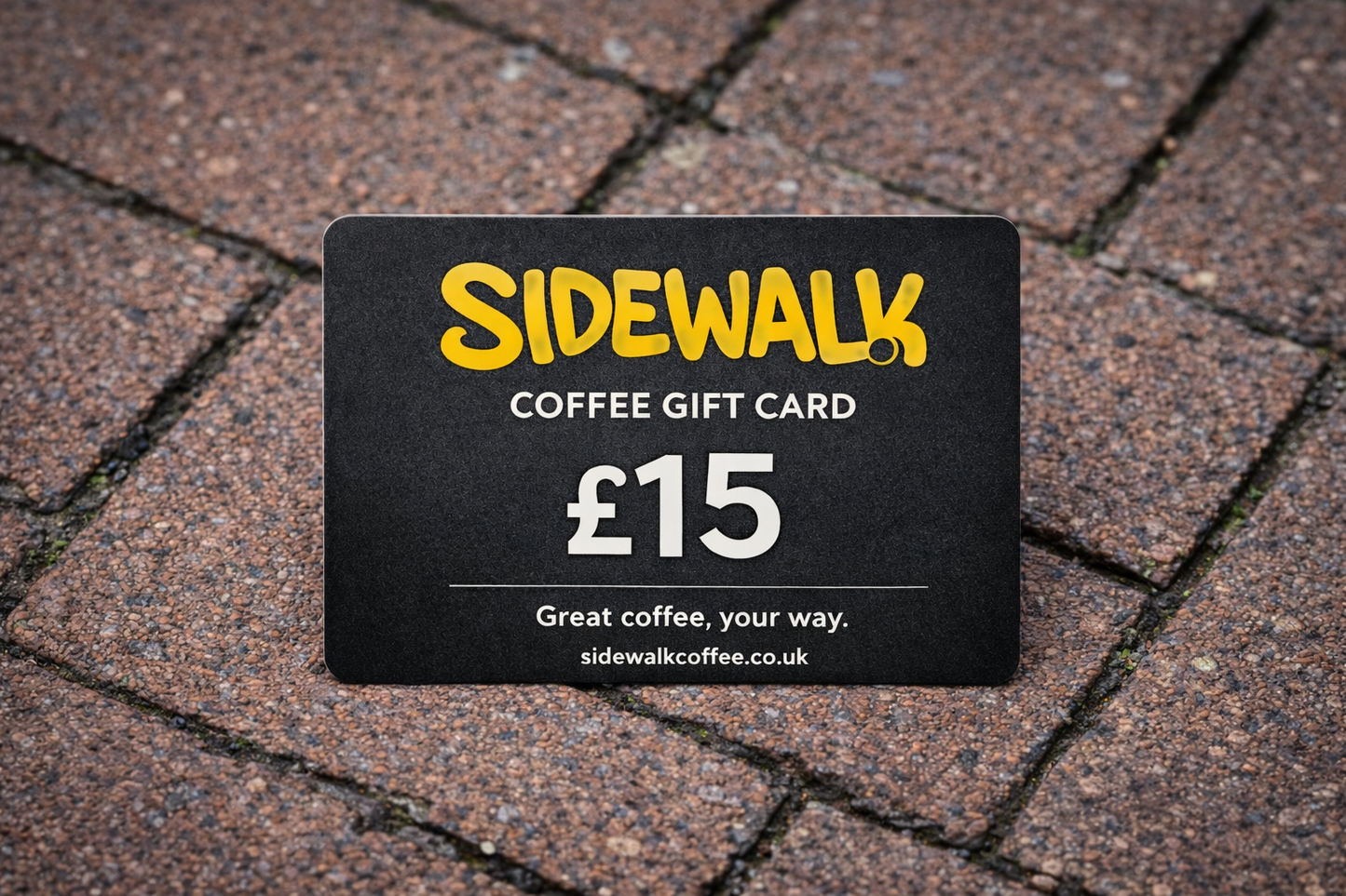 Sidewalk Coffee gift card worth £15 on a textured pavement background