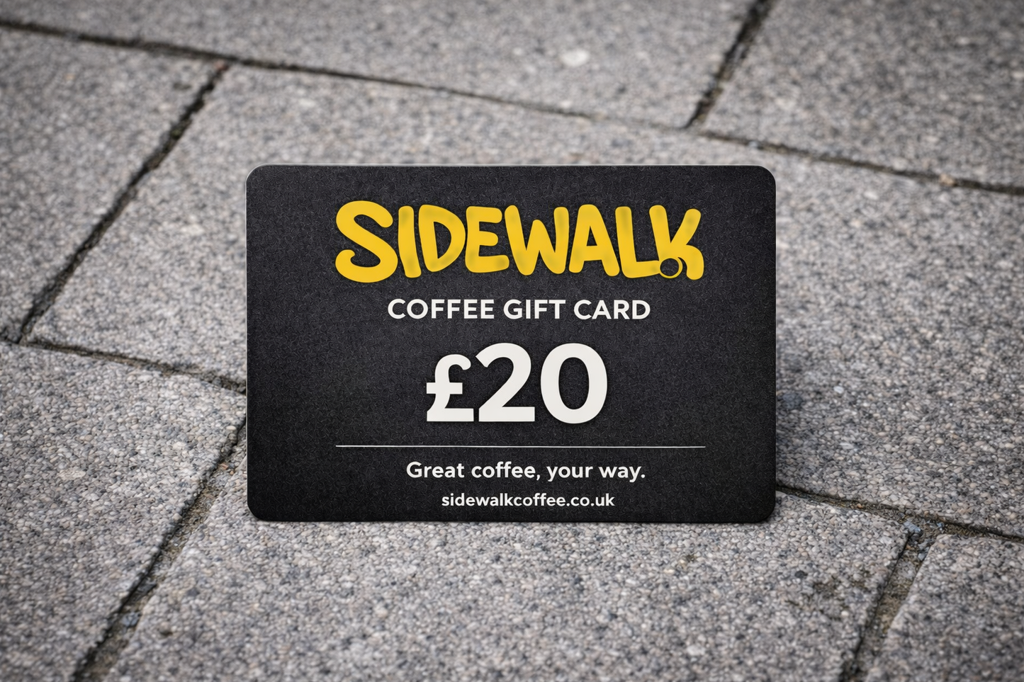 Sidewalk Coffee gift card on a pavement