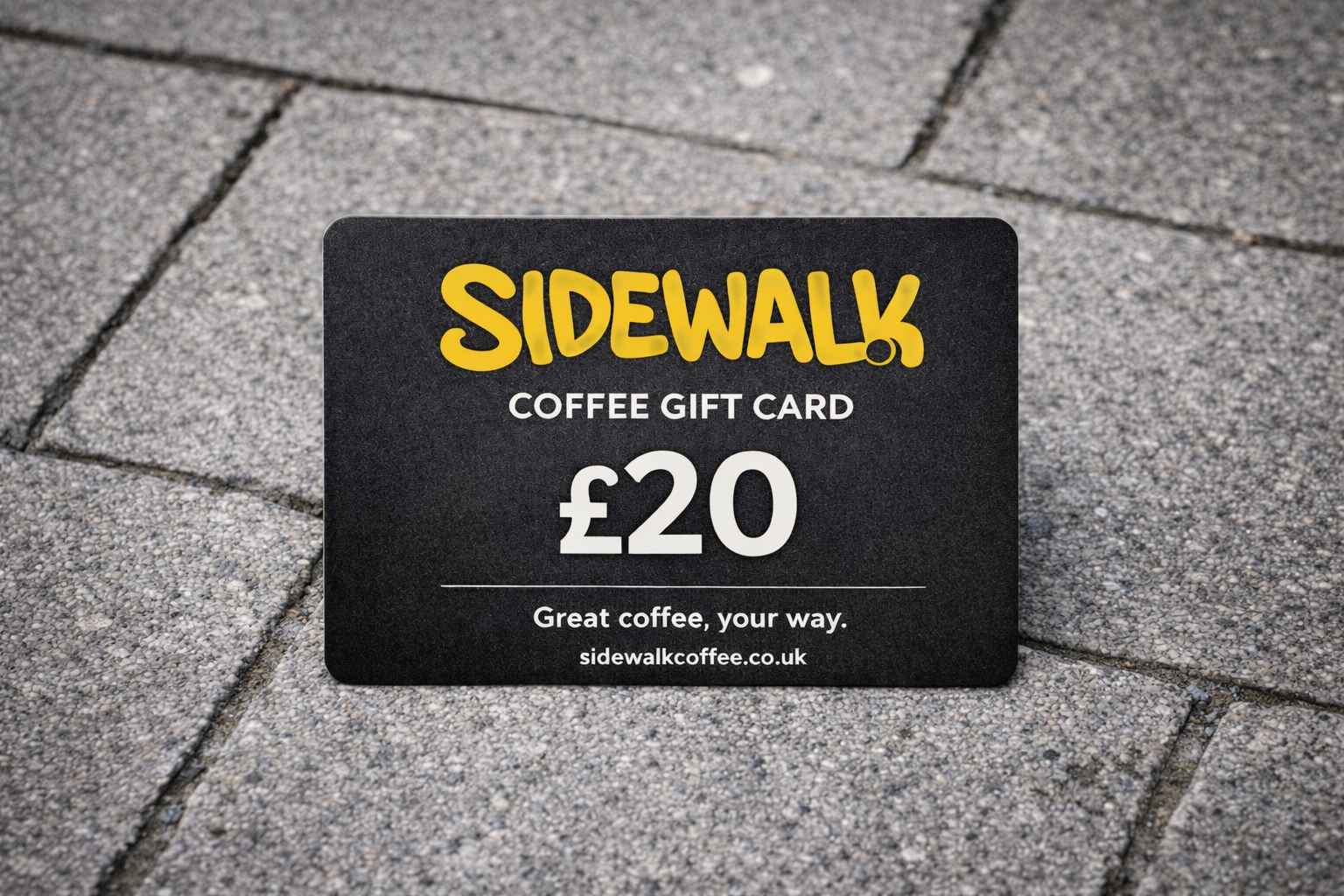 Sidewalk Coffee gift card on a pavement
