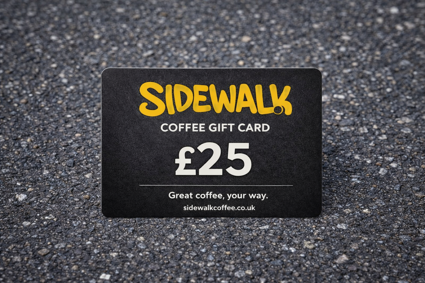 Sidewalk Coffee gift card with £25 value on a textured surface