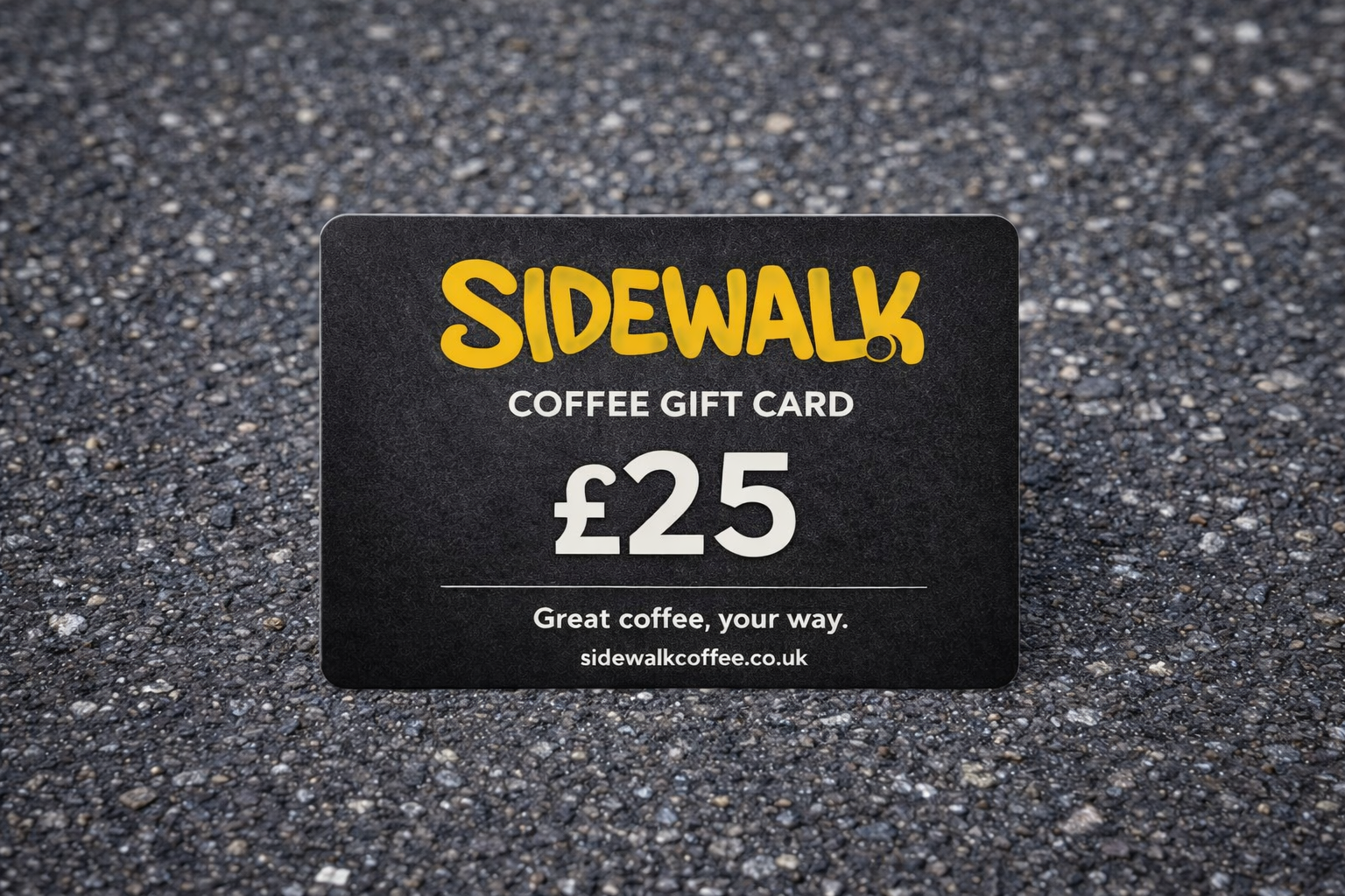 Sidewalk Coffee gift card with £25 value on a textured surface