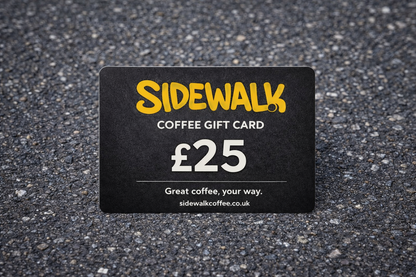 Sidewalk Coffee gift card with £25 value on a textured surface