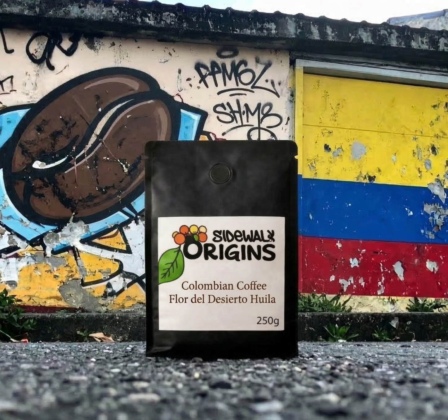 Sidewalk Origins coffee bag in front of a colorful graffiti wall